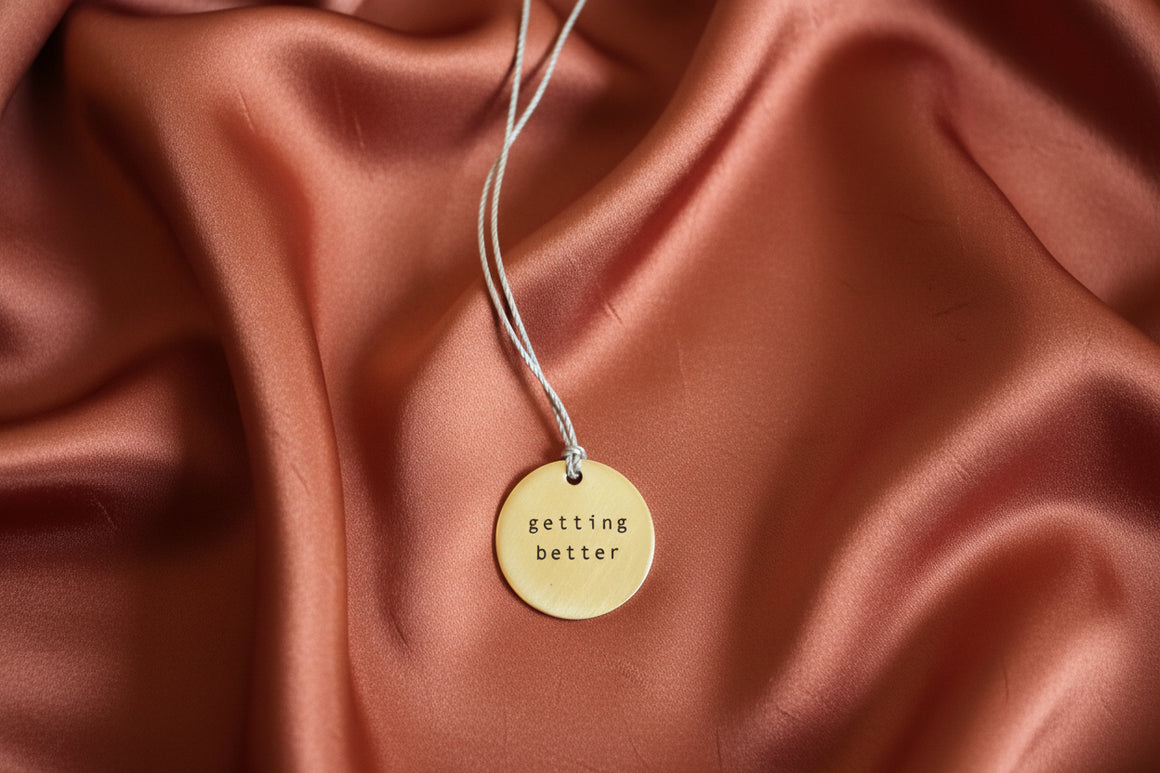 3/4" Tiny Type "Getting Better" Necklace by Everyday Artifacts.